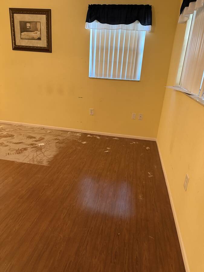 Old brown floor before AG Holmes flooring project in Hudson Florida