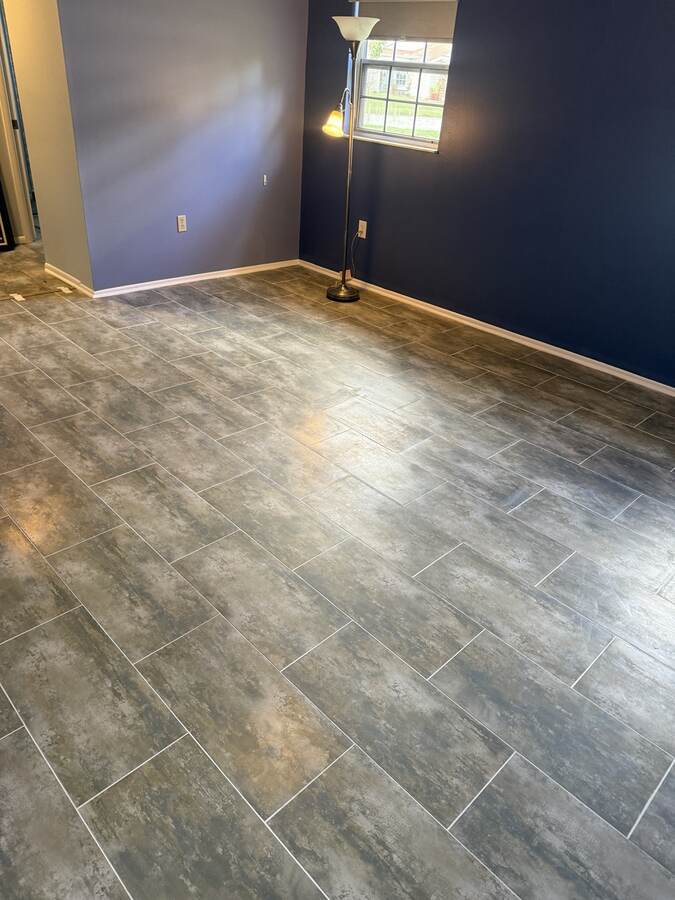 Finished gray plank-look floor after Hudson Florida flooring project