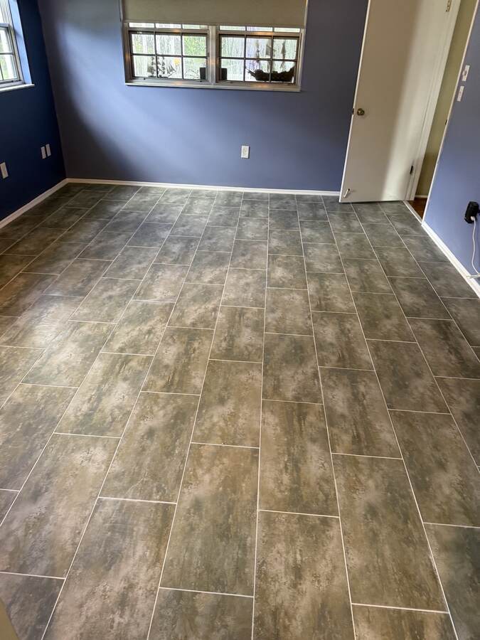 Finished gray plank-look floor with clean layout lines in Hudson Florida