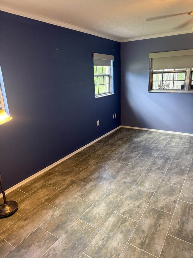 Finished gray plank-look floor across a Hudson Florida living space
